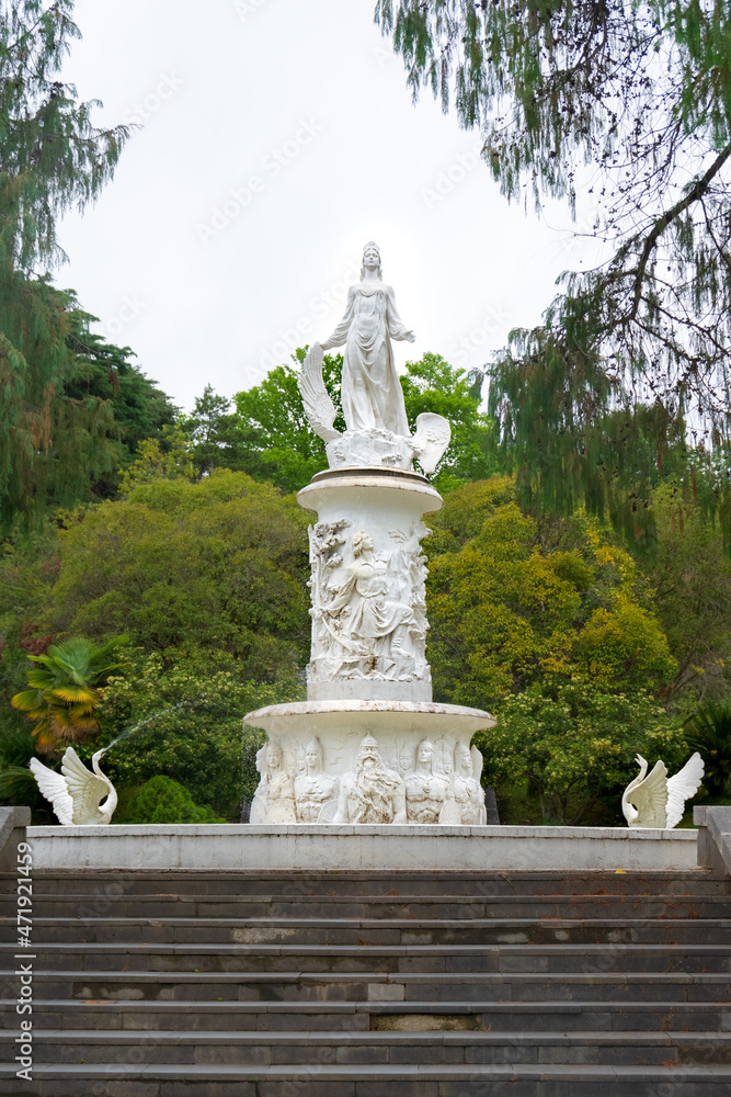 Fountain The Fairytale with sculpture of woman and swans in Sochi Arboretum, Russia