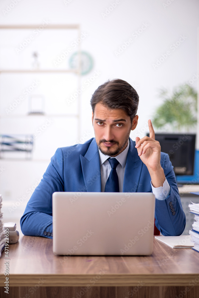 Young businessman employee working in the office Young businessman employee working in the office