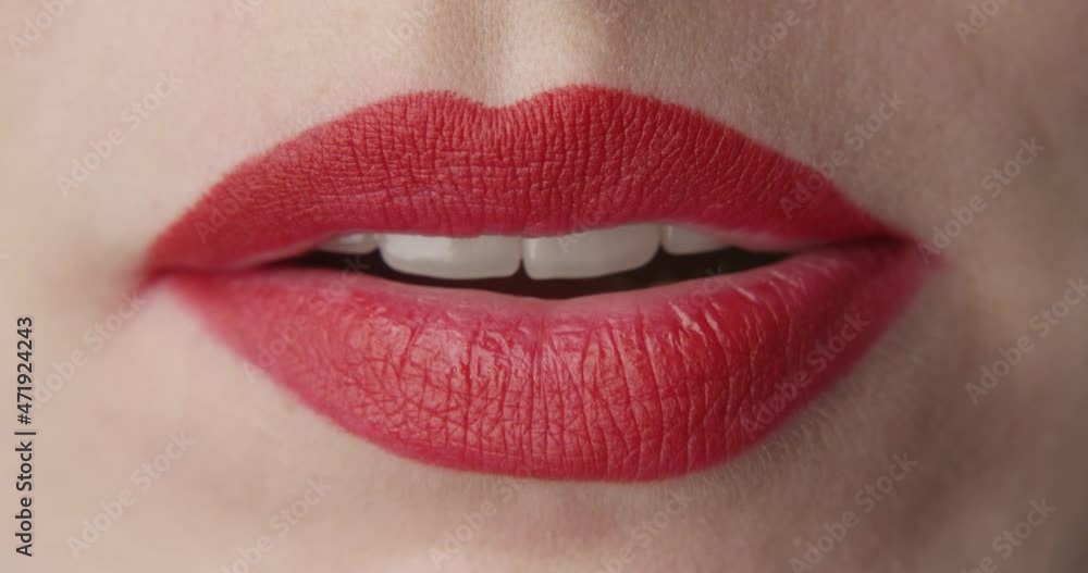 Woman Eating a Green Jelly Candy a Close up Shot of Red Lips and Nails
Woman Eating a Green Jelly Candy a Close up Shot of Red Lips and Nails