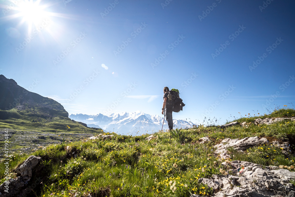 Hiker on a rocky path during tour du mont blanc hike