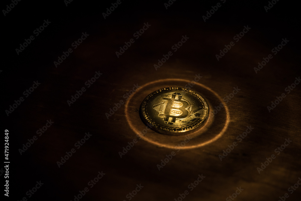 Golden Bitcoin on dark backround. New virtual money. Crypto currency Golden Bitcoin on dark backround. New virtual money. Crypto currency