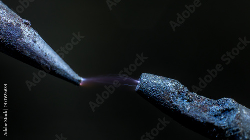 Electric cable close-up with glowing electricity lightning. Macro shot