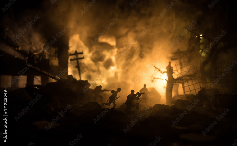 Fototapeta premium War Concept. Military silhouettes fighting scene on war fog sky background, World War Soldiers Silhouette Below Cloudy Skyline At night. Battle in ruined city.