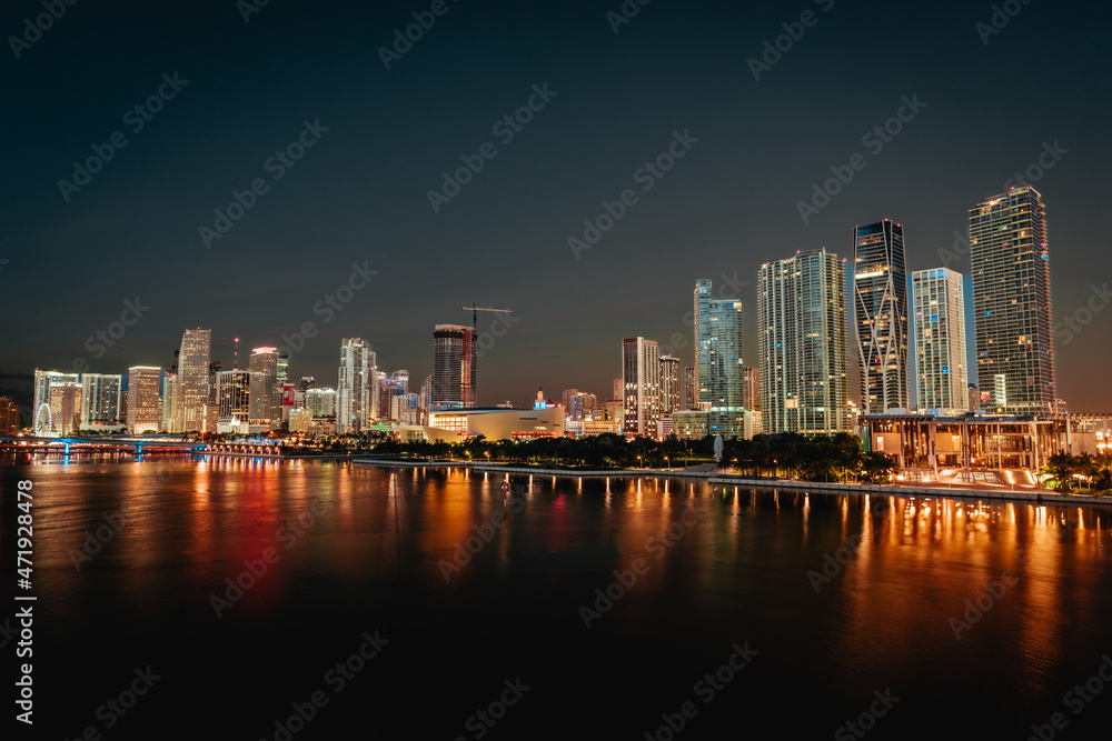 city skyline at night Miami Florida reflections buildings downtown water sea lights  