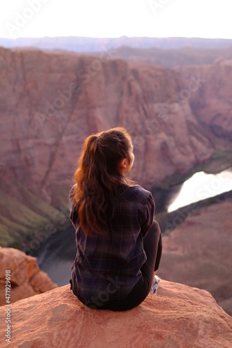 Girl Sitting at Edge of Horseshoe Bend, Arizona