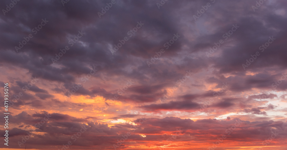 Beautiful sunset sky above clouds with dramatic light