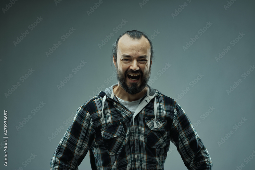 Obraz premium Wicked evil villainous man indulging in manic laughter