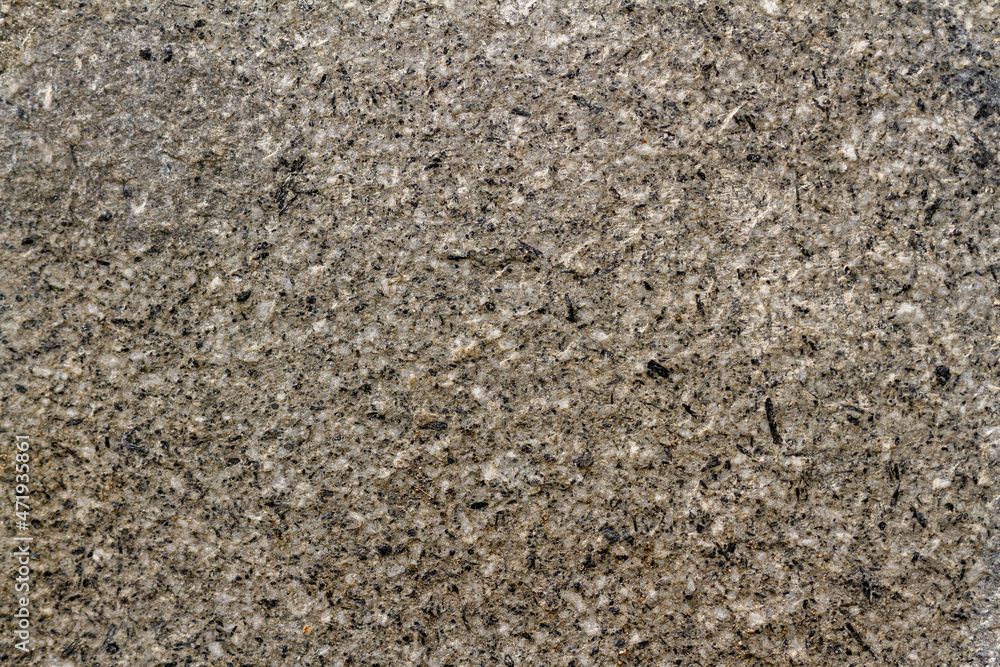 Walls from a mixture of stone and cement as reinforcement for sidewalks and building walls, abstract/texture for the background Walls from a mixture of stone and cement as reinforcement for sidewalks and building walls, abstract/texture for the background
