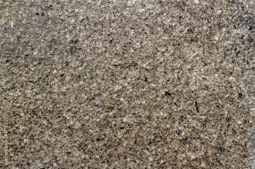 Walls from a mixture of stone and cement as reinforcement for sidewalks and building walls, abstract/texture for the background