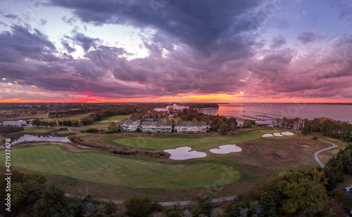 Aerial sunset view of a resort with a golf course near the Chesapeake in Cambridge Maryland with dramatic sky photo