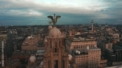 Aerial close up view of the tower of the Royal Liver Building in Liverpool, UK during beautiful sunset. photo