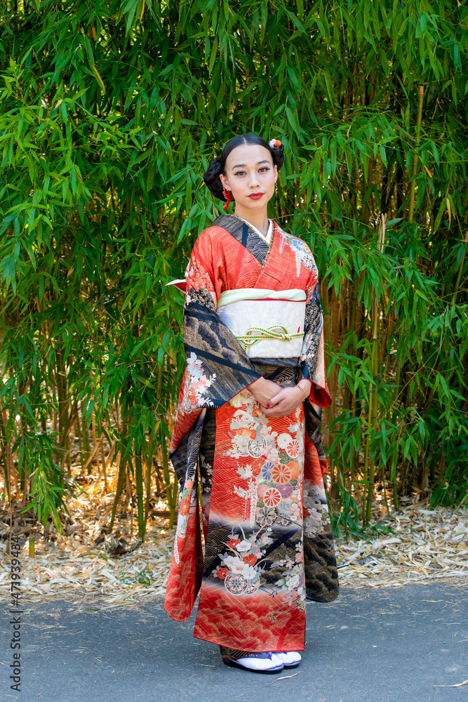 Portrait of woman wearing kimono standing in park Portrait of woman wearing kimono standing in park