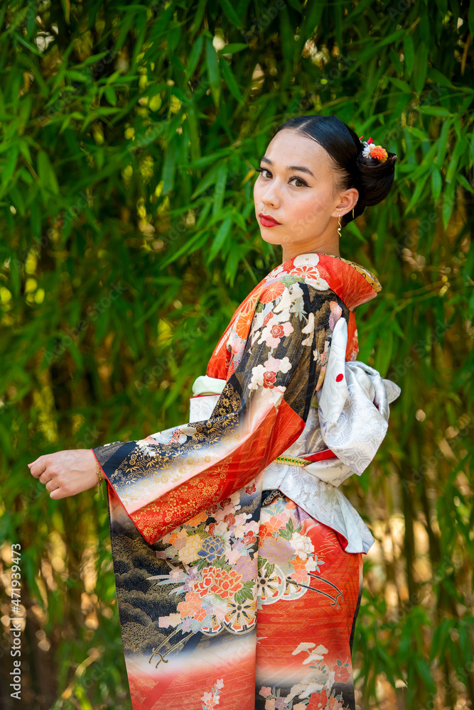 Portrait of woman wearing kimono standing in park Portrait of woman wearing kimono standing in park