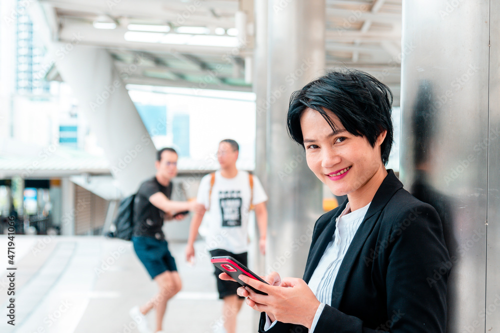 Business woman using smartphone shopping online, call, texting message internet technology lifestyle. Asian woman using cellphone walking on city street. Smart phone smart confident woman modern city