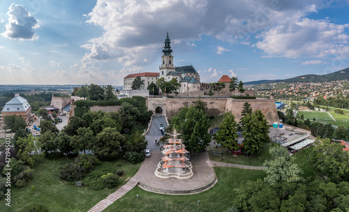 Aerial view of Nitra castle in Slovakia with bastions and sentry towers, bishop palace and baroque church tower above the city photo