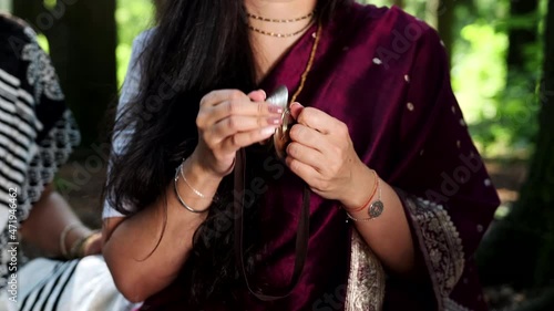 Puja worship of God. Women's hands play the bells