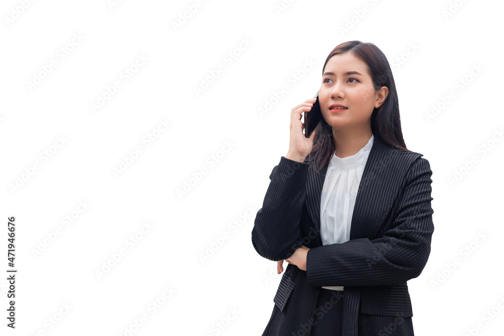 Beautiful Southeast Asian Thai woman in a formal suit is standing and talking on the phone. Concept of business woman isolated on white background. Beautiful Southeast Asian Thai woman in a formal suit is standing and talking on the phone. Concept of business woman isolated on white background.