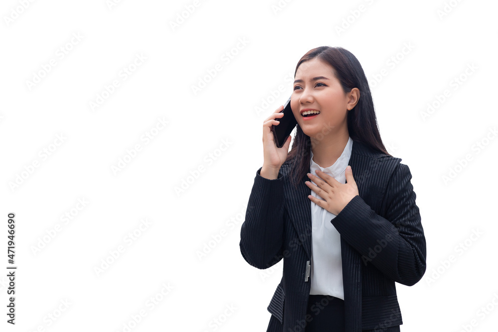 A beautiful South East Asian Thai woman in a formal suit is standing and talking on the phone with a smiling face and a happy expression. Concept of business woman isolated on white background. A beautiful South East Asian Thai woman in a formal suit is standing and talking on the phone with a smiling face and a happy expression. Concept of business woman isolated on white background.