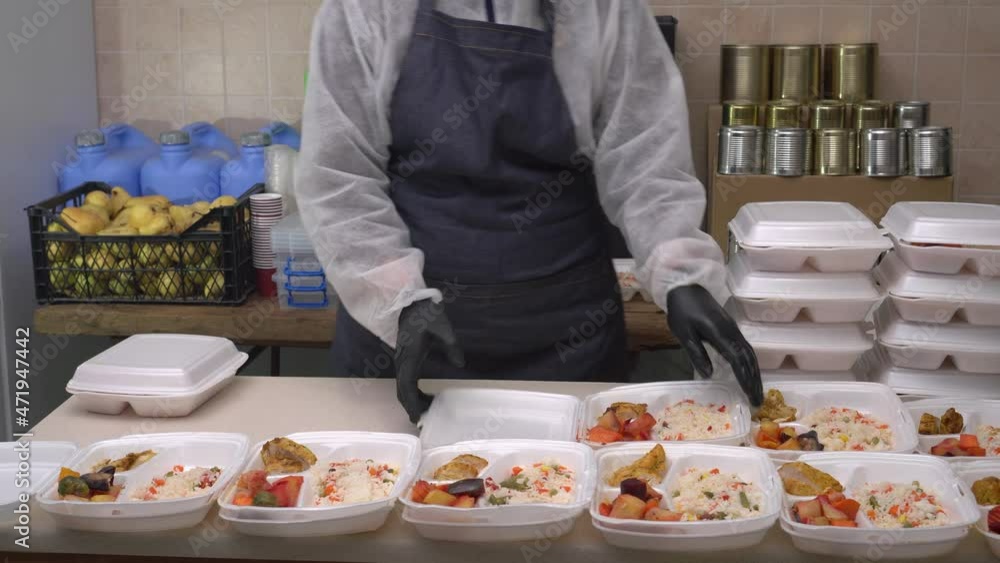 Holiday Food Bank Volunteer. Hot takeaway food in a plastic disposable package Holiday Food Bank Volunteer. Hot takeaway food in a plastic disposable package