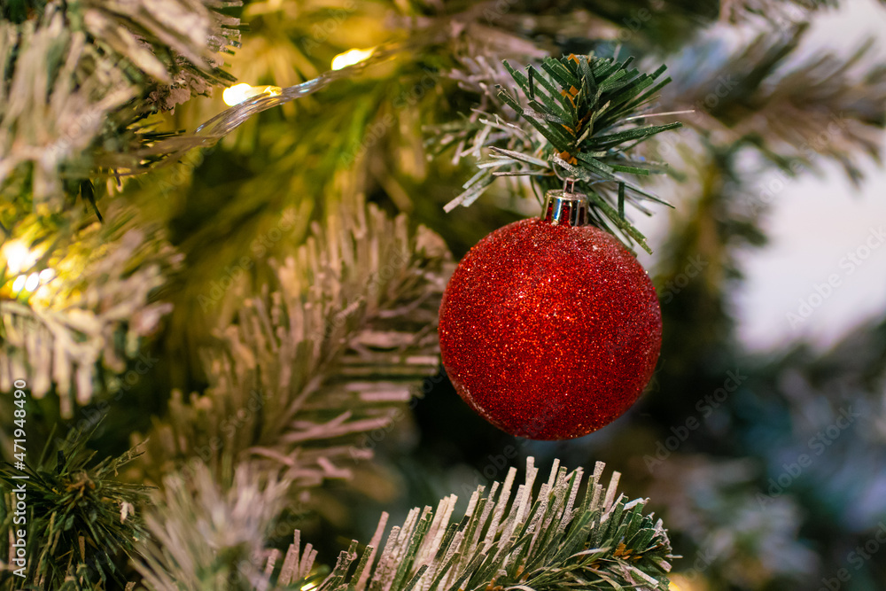 Red christmas ball and gift decoration on christmas tree night scene