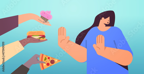 woman showing no stop gesture to junk food unhealthy nutrition junkfood addiction stop fast food concept