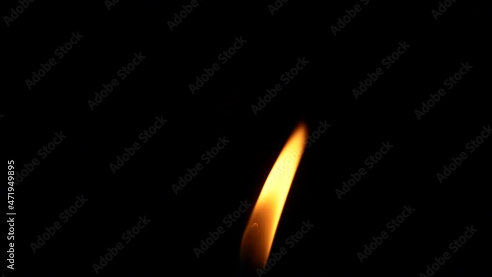 Closeup candle fire flame isolated burning on black background, slow motion HD Closeup candle fire flame isolated burning on black background, slow motion HD