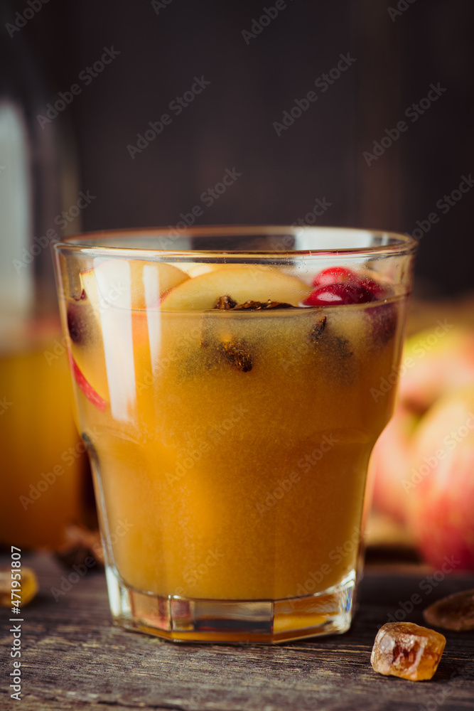 Traditional hot apple cider. Christmas drink with apples cinnamon, cranberry and anise. Homemade apple cider. Selective focus. Shallow depth of field. Traditional hot apple cider. Christmas drink with apples cinnamon, cranberry and anise. Homemade apple cider. Selective focus. Shallow depth of field.