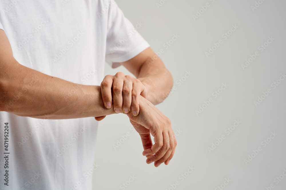 man holding hand injury pain health problem man holding hand injury pain health problem
