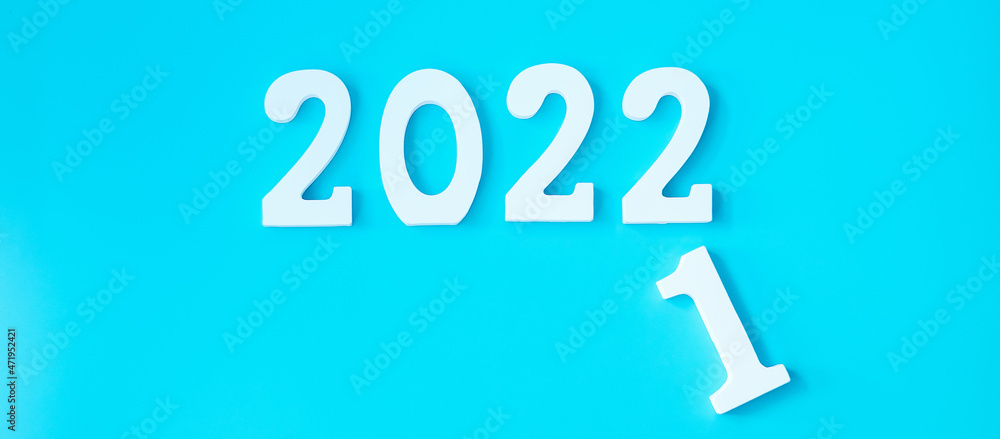 2022 white text number on blue background. Resolution, plan, review, goal, start and New Year holiday concepts 2022 white text number on blue background. Resolution, plan, review, goal, start and New Year holiday concepts