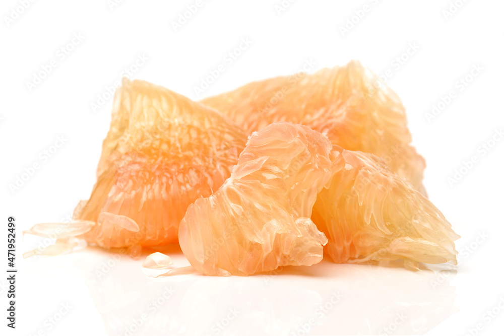 peeled pomelo pieces isolated on white background. Tasty fresh fruit eating concept. peeled pomelo pieces isolated on white background. Tasty fresh fruit eating concept.