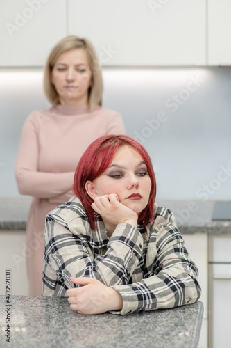 Family conflict. Unhappy mother and her daughter are offended at each other