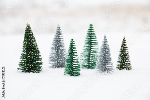 Christmas trees in a snowdrift, on a snowy winter December day, New Year's card