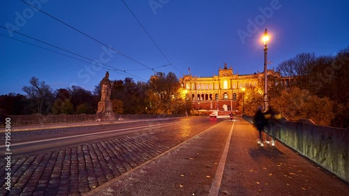 Night timelapse of Munich at night with trams and heavy traffic. Germany photo