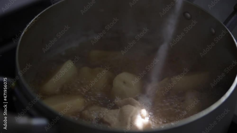 Hotpot with potato boiling in water, Japan Hotpot with potato boiling in water, Japan