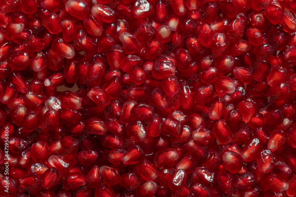 red grains of ripe pomegranate background, peeled pomegranate red grains of ripe pomegranate background, peeled pomegranate