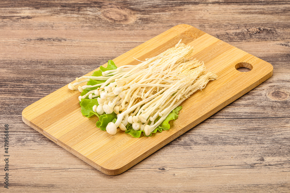 Raw Enoki mushrooms for cooking