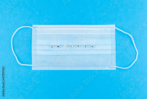 the word omicron on a protective mask