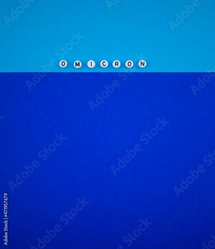 Covid-19 new variant - Omicron text on blue background