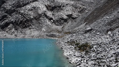 Blue lake and snowy peaks at Lake 69, Huascaran National Park, Huaraz, Peruvian Andes photo