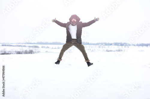 Wallpaper Mural Outdoor portrait of handsome man in coat and scurf. Bearded man in the winter woods. Torontodigital.ca
