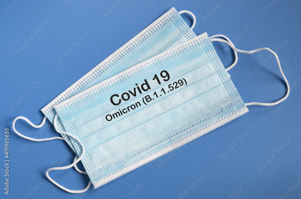 antiviral medical masks for protection against coronavirus with text Covid 19 Omicron Variant. COVID-19 omicron variant strain protection concept. antiviral medical masks for protection against coronavirus with text Covid 19 Omicron Variant. COVID-19 omicron variant strain protection concept.