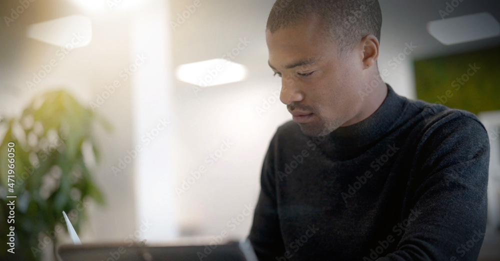 Young african man working in an office Young african man working in an office