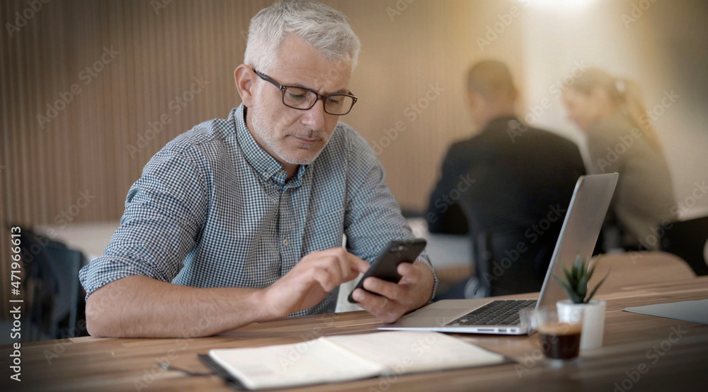man working coworking on his laptop in an office