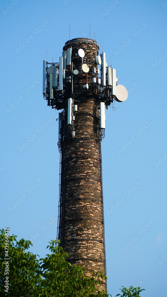 Telecommunication tower of 4G and 5G cellular. Base Station or Base Transceiver Station. Wireless Communication Antenna Transmitter. fragment of antenna construction over blue sky. Telecommunication tower of 4G and 5G cellular. Base Station or Base Transceiver Station. Wireless Communication Antenna Transmitter. fragment of antenna construction over blue sky.