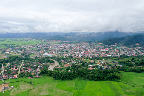 Scenic aerial view flying over the land field.