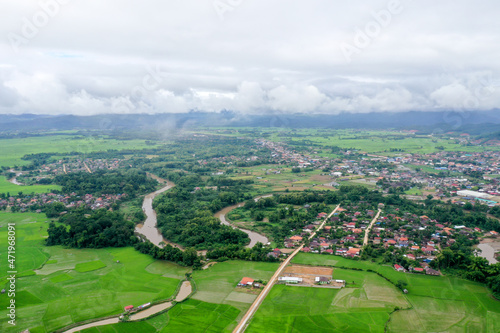 Scenic aerial view flying over the land field.