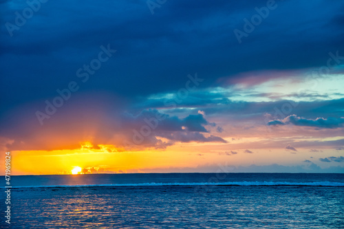 Fototapeta Naklejka Na Ścianę i Meble -  Amazing sunset above the ocean. Yellow, blue and orange colors.
