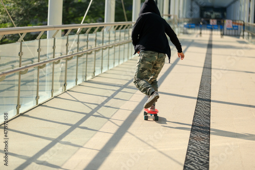 Skateboarder riding skateboard at city