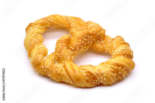 Cretzel isolated on white background. Cretzel is a pretzel-croissant hybrid that combining the perfect chewy bite of a pretzel with the luxurious buttery, flaky pastry of a croissant