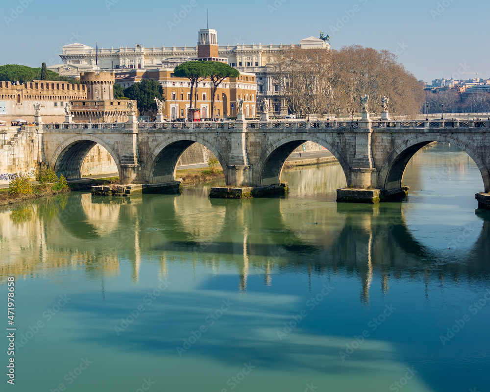 A view of Ponte Sant'Angelo (Bridge of Hadrian) on Tiber river in front of Castel Sant'Angelo (Castle of the Holy Angel)  in Parco Adriano, Rome, Italy